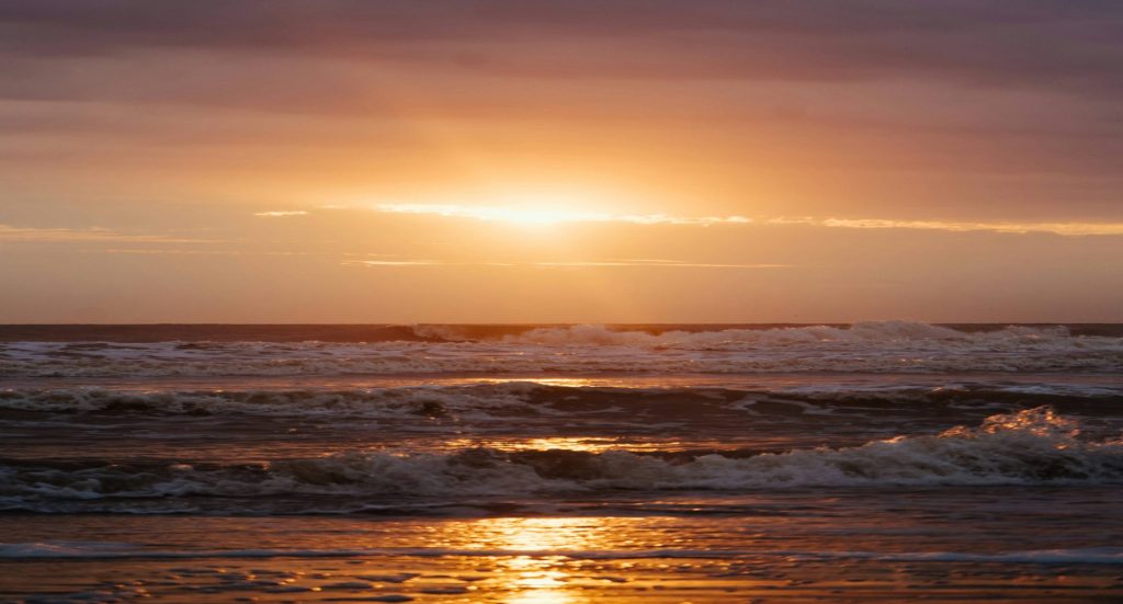 Soft sunrise through a window, a symbol of hope after a suicidal crisis — mental health support in Kenya